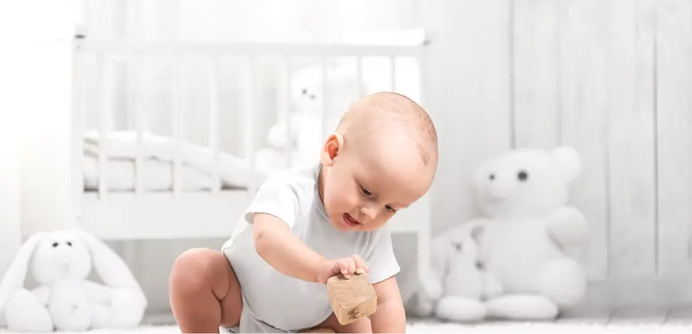 A baby's hand beside a stethoscope